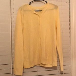 Yellow cardigan.